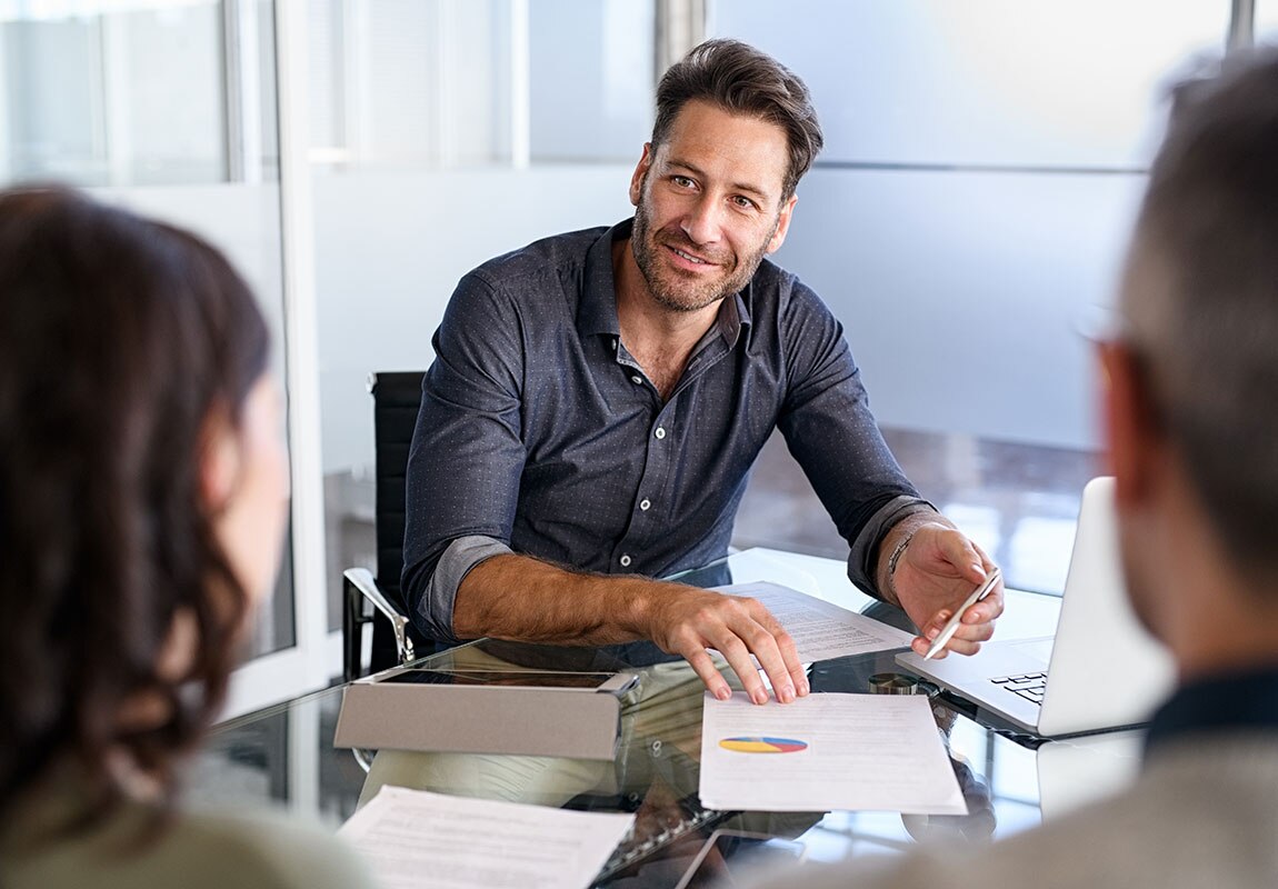Banker reviewing financial data with clients
