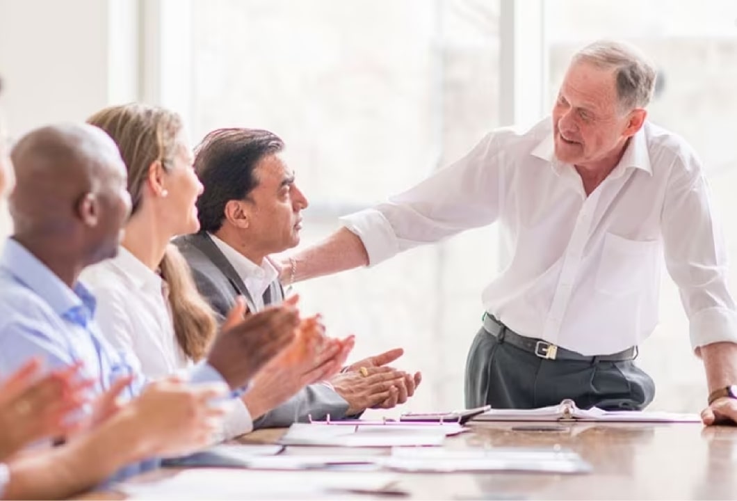 CEO naming successor in a business meeting