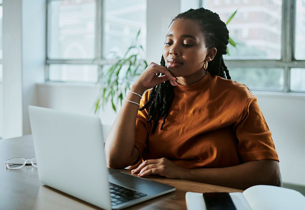 African-American woman working on laptop