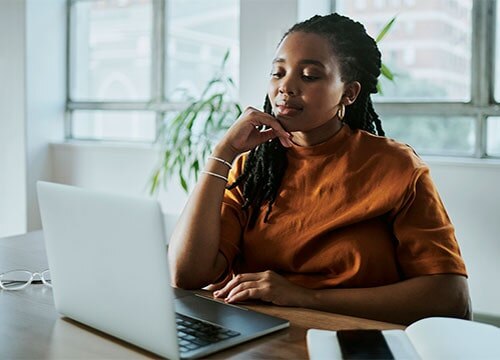 African-American woman working on laptop
