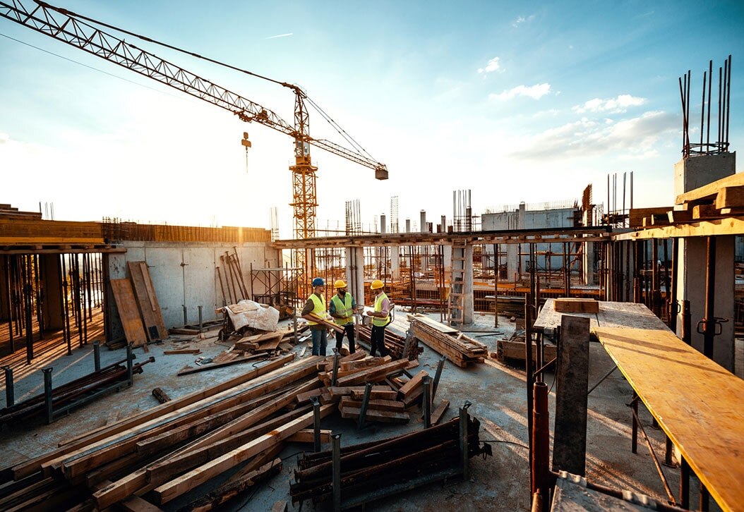 Workers reviewing progress on a construction site