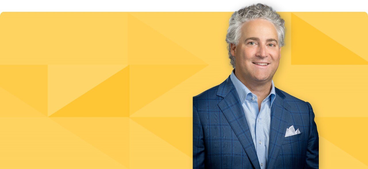 Headshot of Joseph Sofia on gold tessellated background