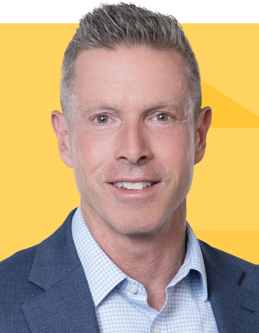 Kirk Reis's headshot on a gold tessellated background