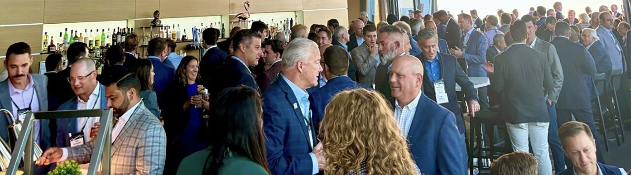 Businesspeople conversing at the 2024 ACG Great Lakes Capital Connection© Conference