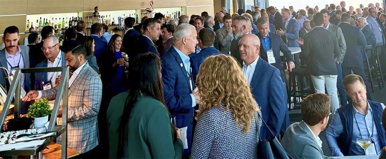Businesspeople conversing at the 2024 ACG Great Lakes Capital Connection© Conference