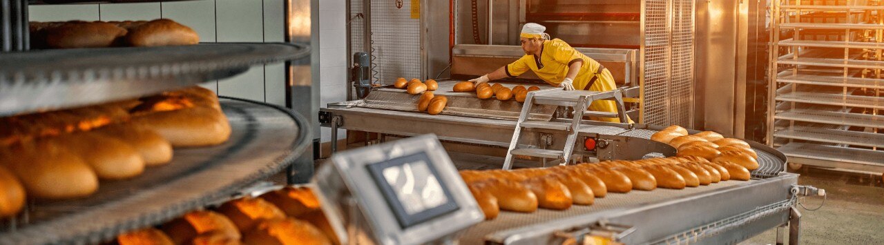 Person working in industrial bakery