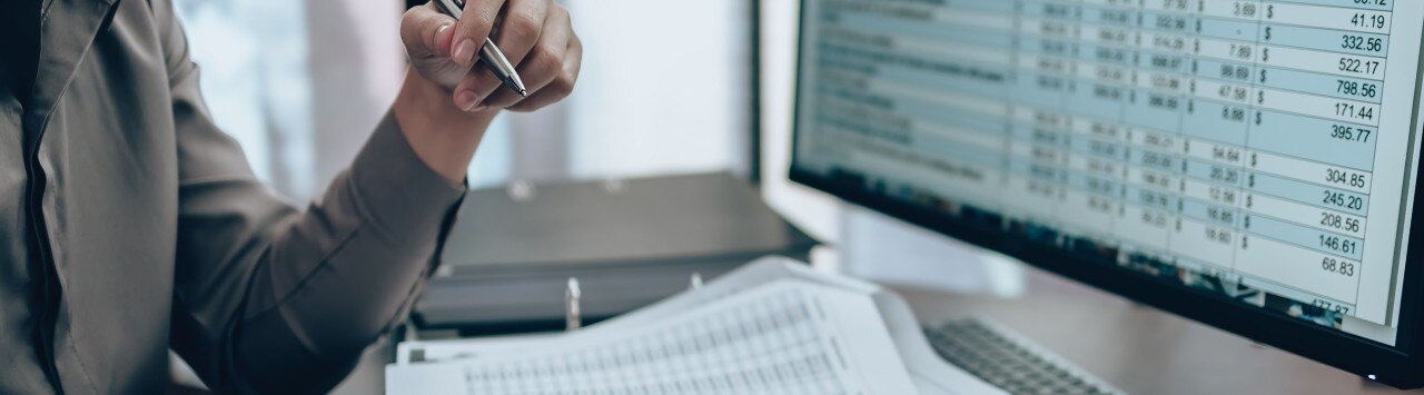 Employee looks over analytics on desktop