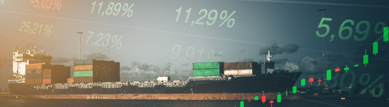 Stock charts and percentages superimposed over a wide view of fuel barges