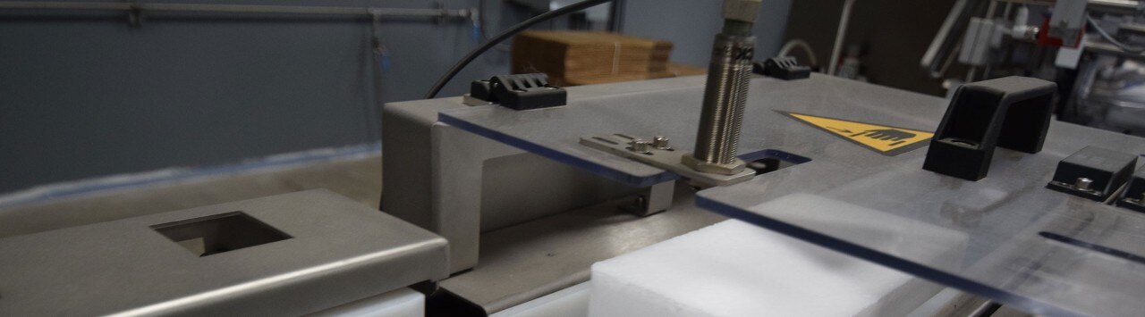 Machinery forming bricks of dry ice