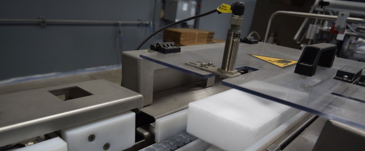 Machinery forming bricks of dry ice