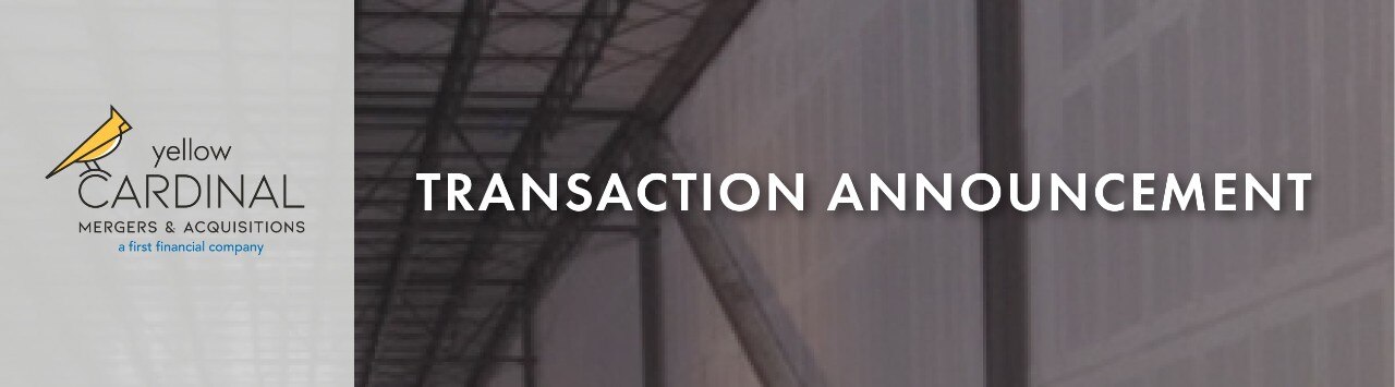 Yellow Cardinal Merger and Acquisitions logo with image off metal framing inside a warehouse and the words "Transaction Announcement"