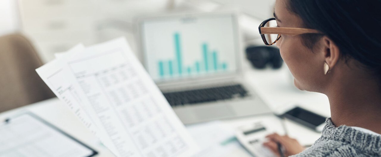 Female business owner reviewing financial documents