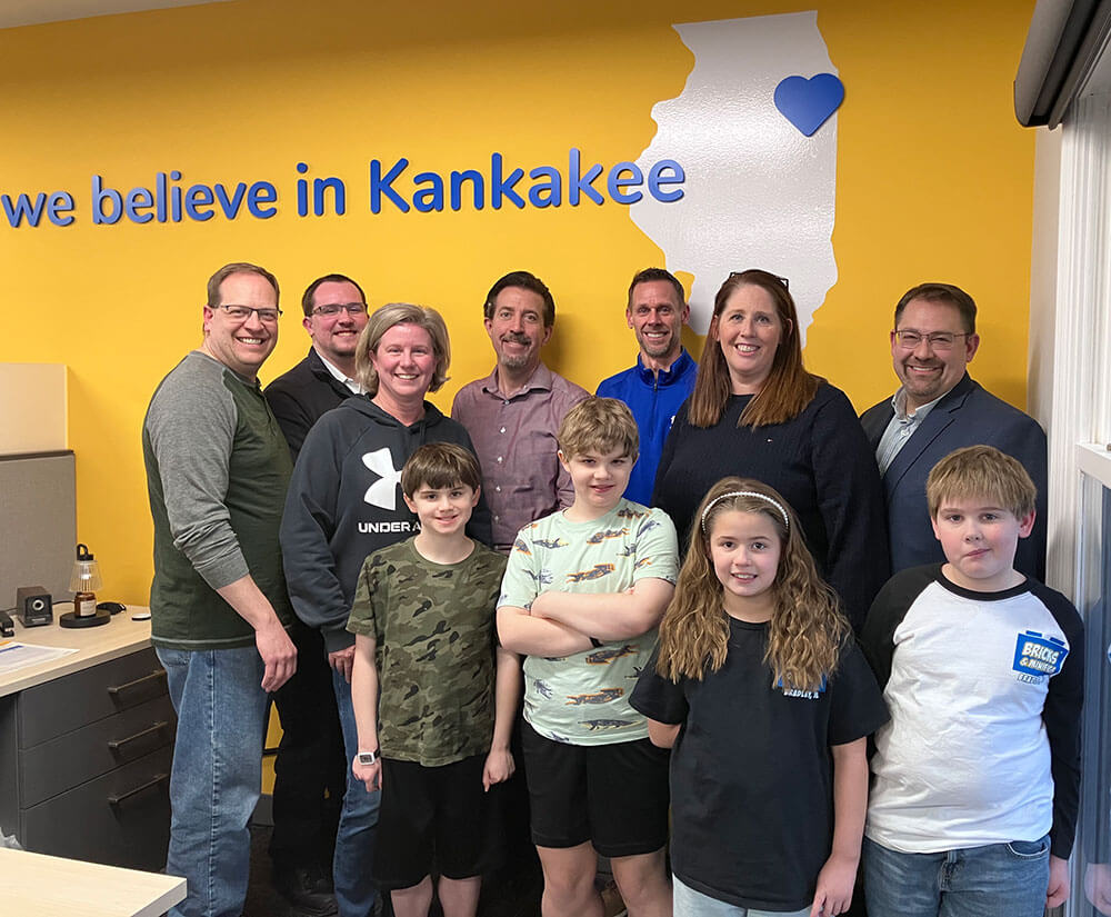 Bricks & Minifigs Bradley co-owners, their families, and members of the First Financial Bank team