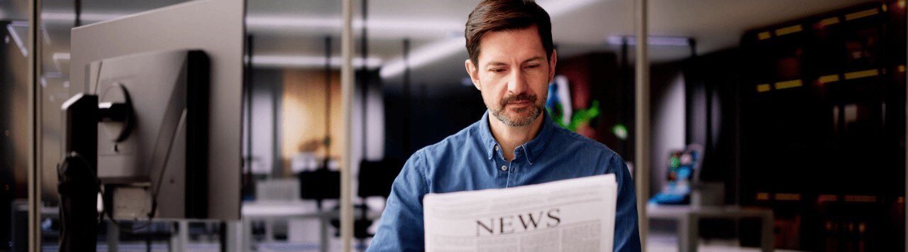 Businessman reading news in an office