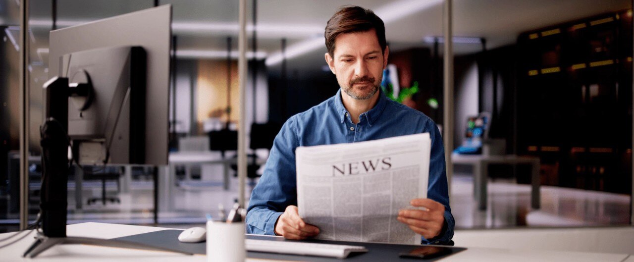 Businessman reading news in an office