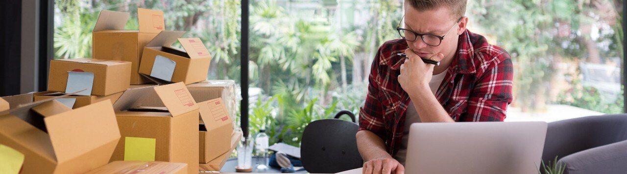 Stressed small business owner looking at computer