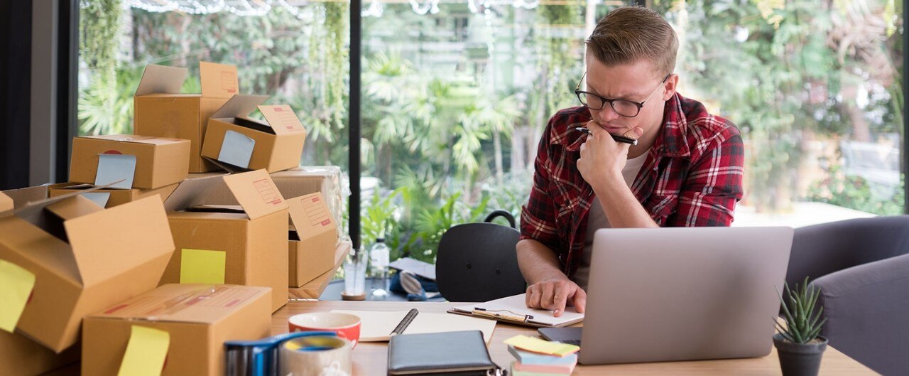 Stressed small business owner looking at computer