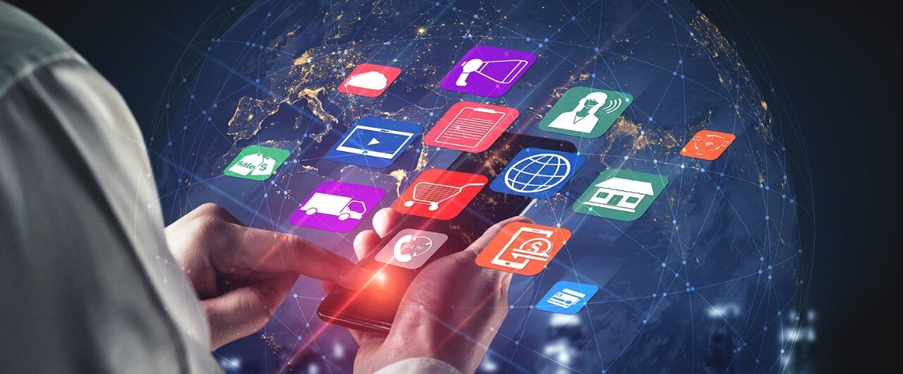 A man holding a phone with digital apps popping out of the screen.