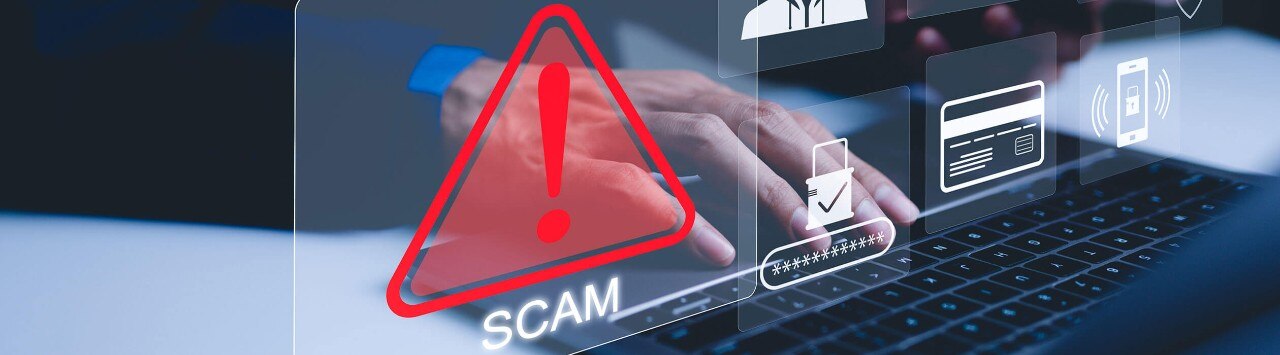 A person typing on a laptop. In the foreground, icons show alerts and potential scams.