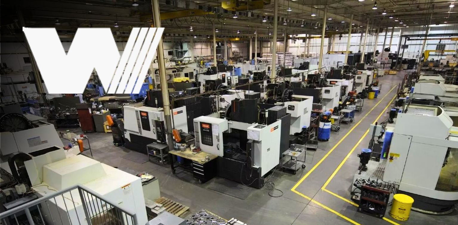 Wide view of manufacturing plant with rows of machines