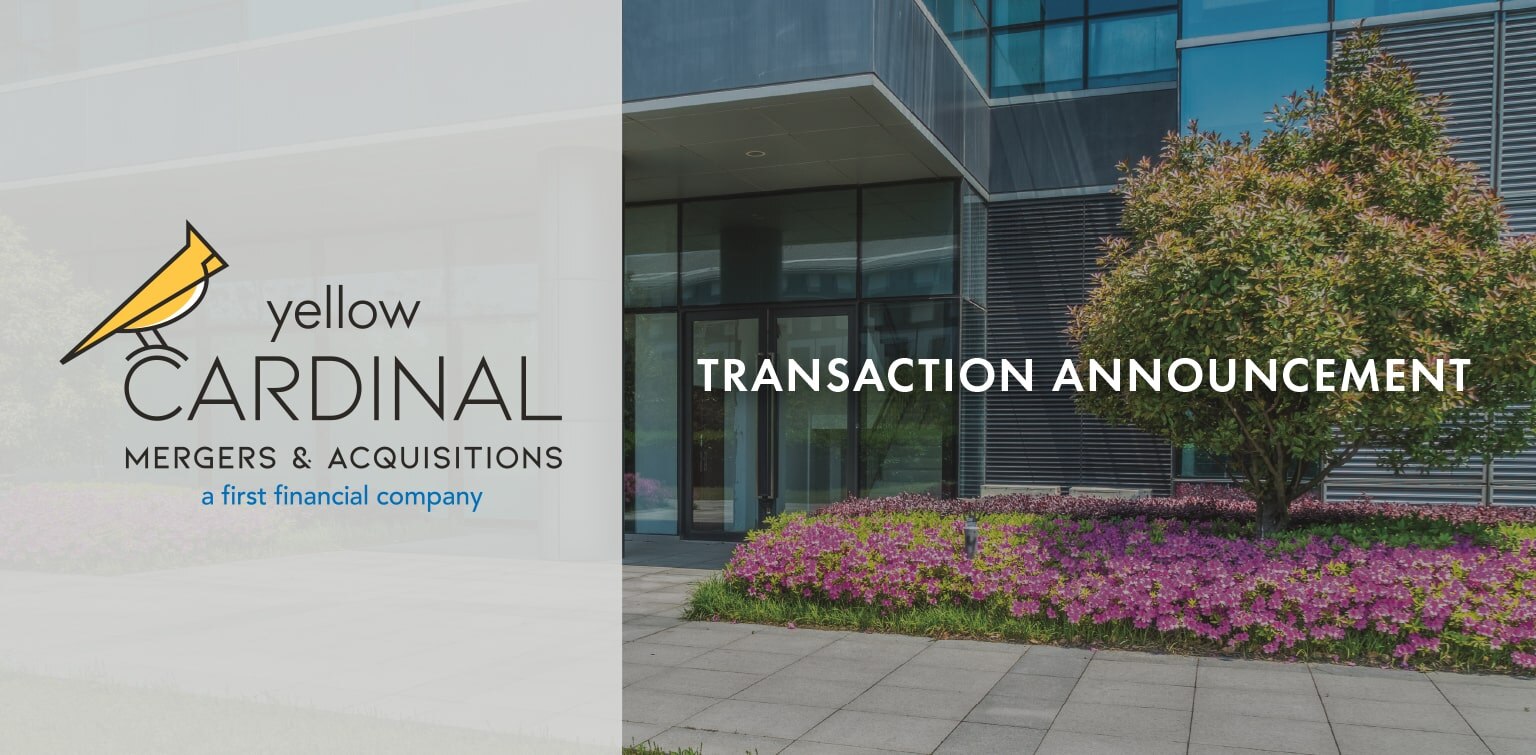 Yellow Cardinal Mergers & Acquisitions logo next to image of landscaped area