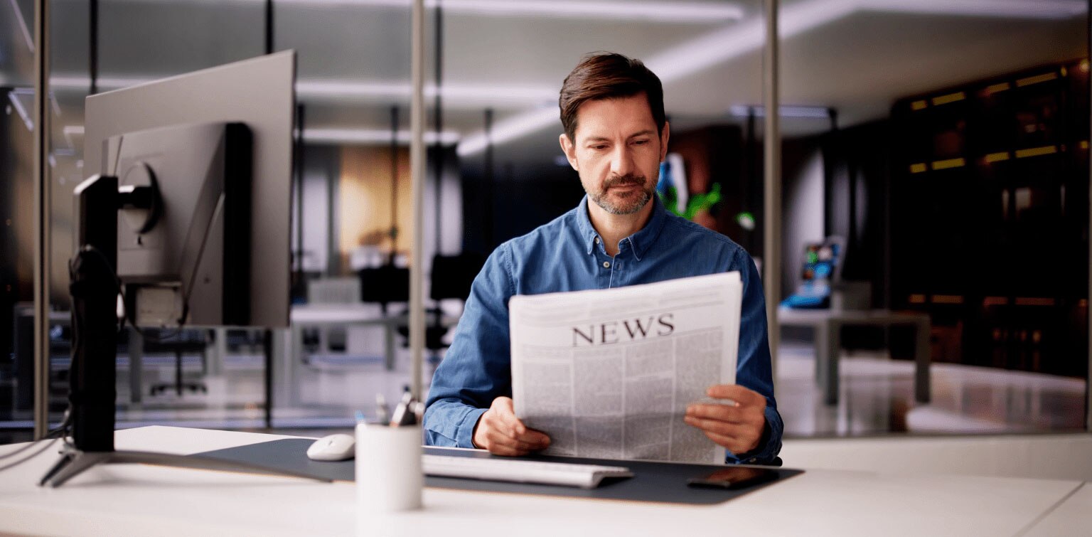 Businessman reading news in an office
