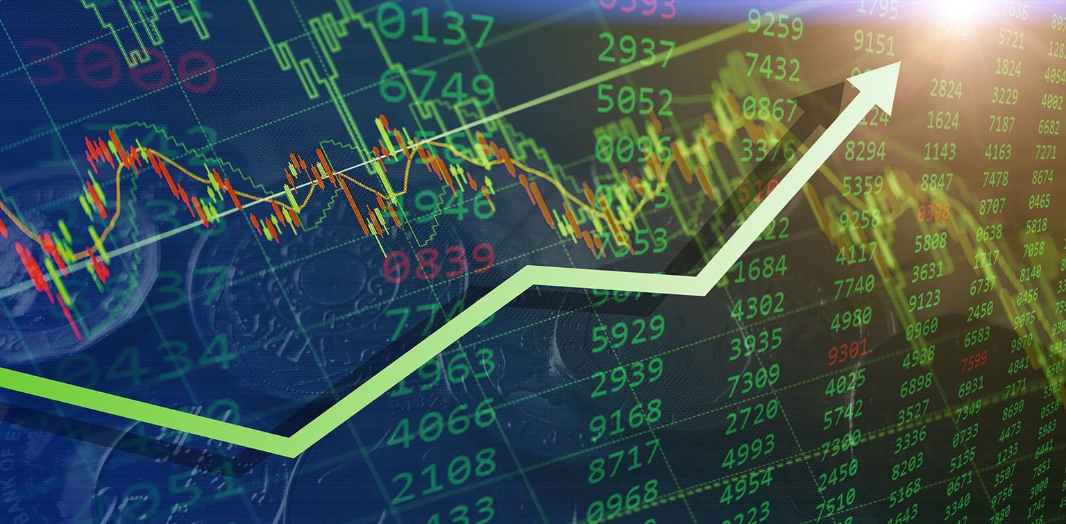 Digital image of stock data with a green upward-trending arrow indicating a bullish market