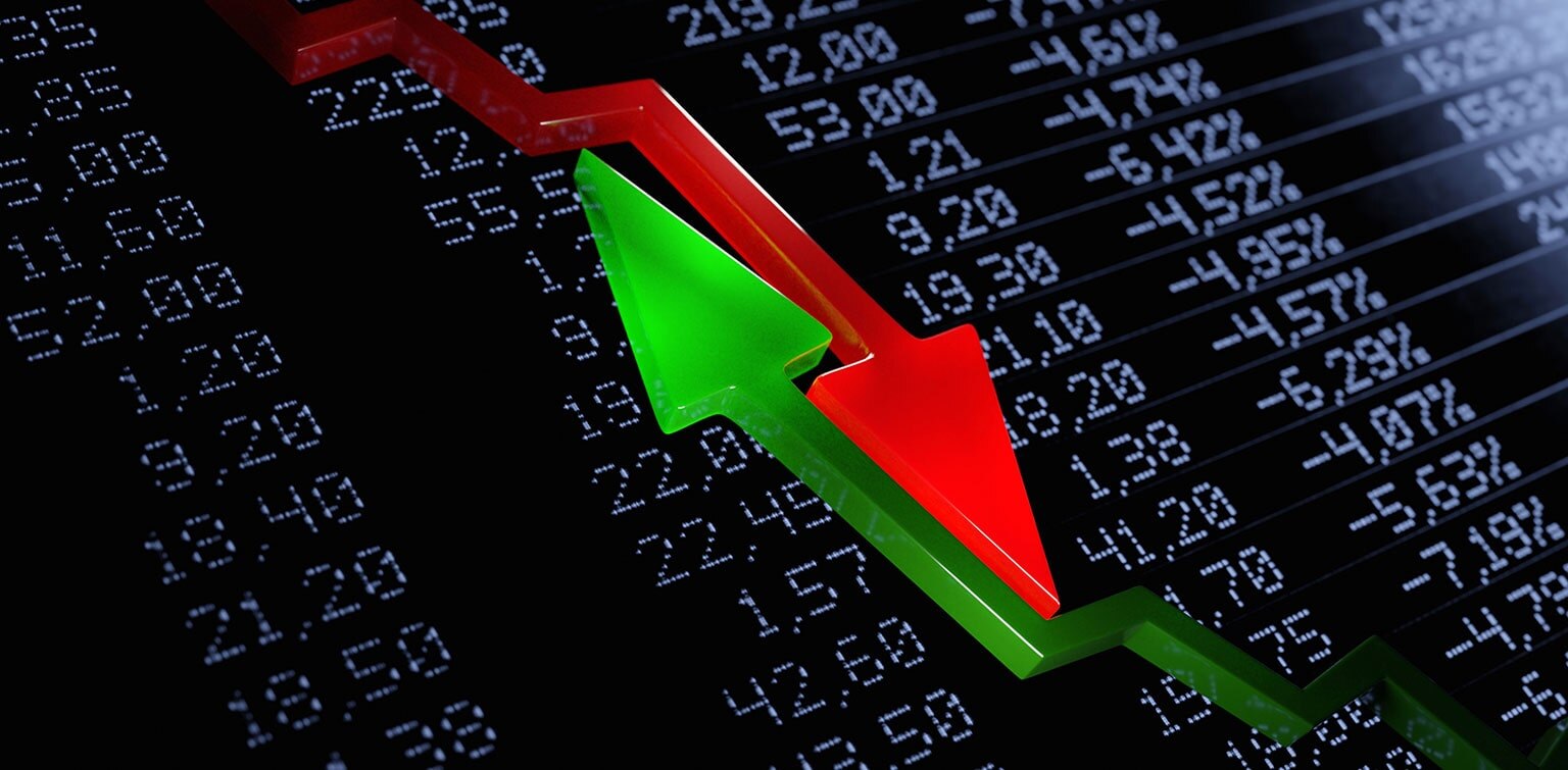 Opposing red and green arrows over financial figures