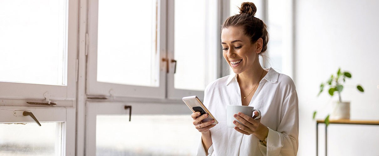 Young businesswoman using smartphone in an office