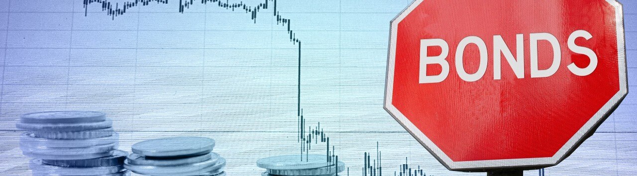 Stop sign labeled "Bonds" with coins and downward-trending graph in background