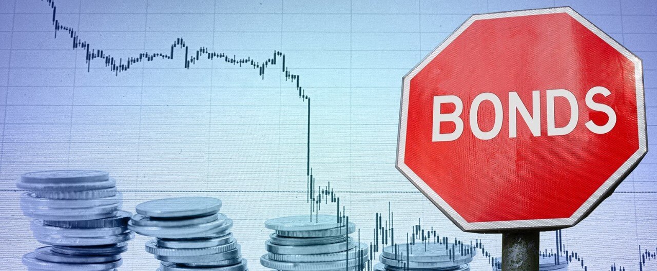 Stop sign labeled "Bonds" with coins and downward-trending graph in background