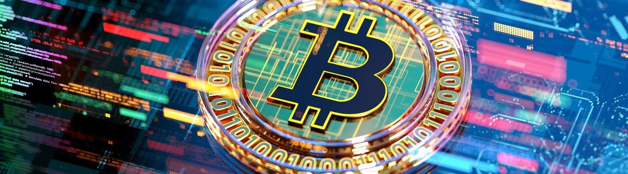 Bitcoin symbol superimposed over rapidly-moving digital stock market data