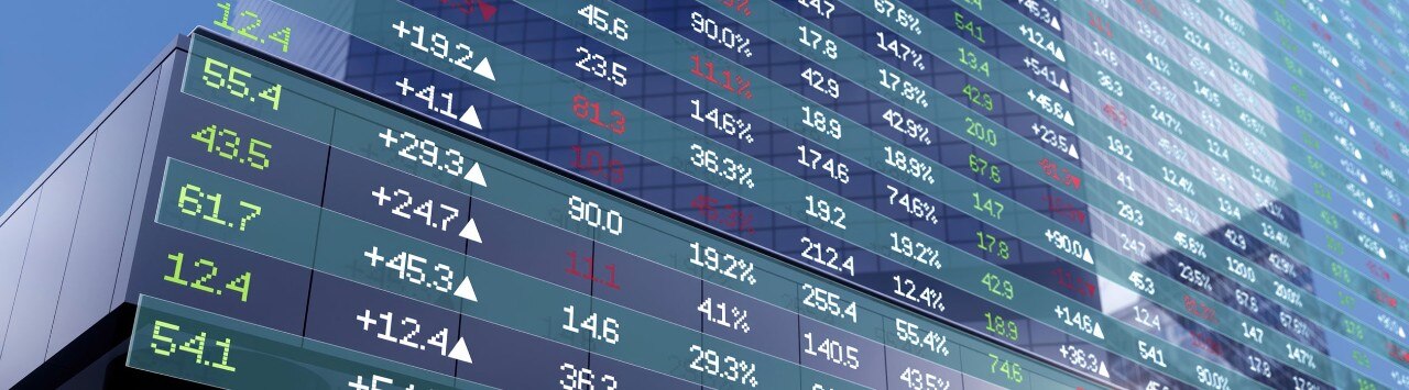 Large digital screen displaying stock prices