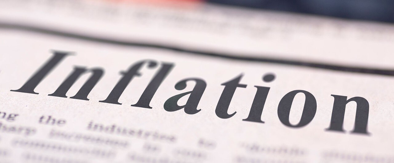 Close up of the word "Inflation" in a newspaper headline