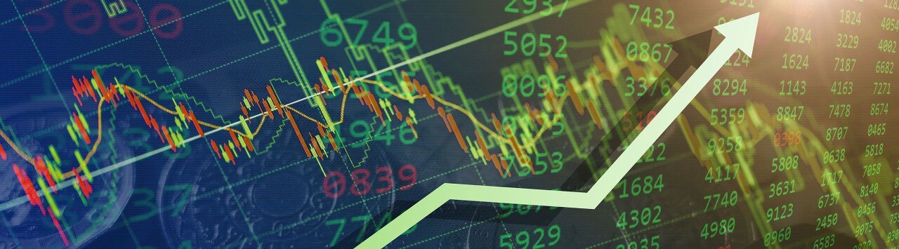 Digital image of stock data with a green upward-trending arrow indicating a bullish market