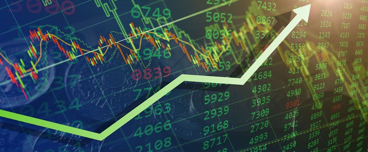 Digital image of stock data with a green upward-trending arrow indicating a bullish market