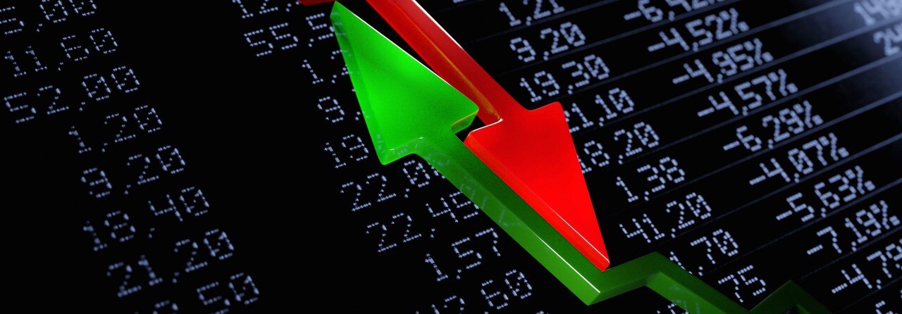 Opposing red and green arrows over financial figures