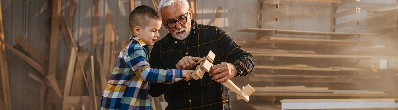 man with boy woodworking