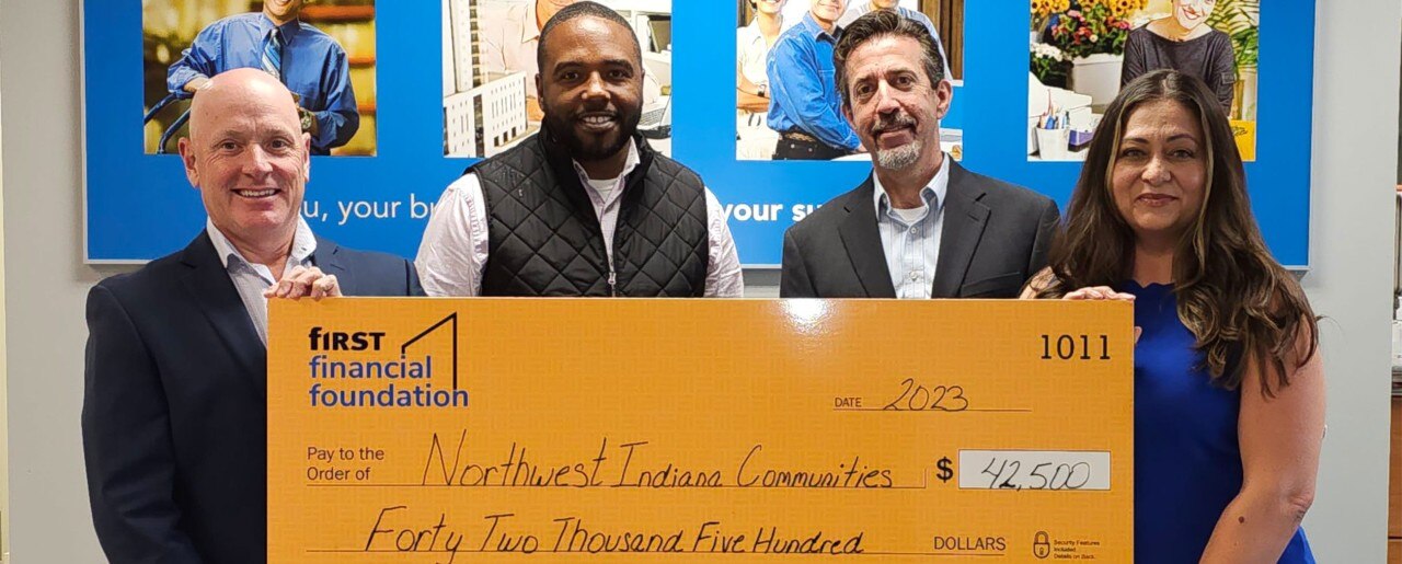 First Financial associates presenting a donation check to Northwest Indiana Communities