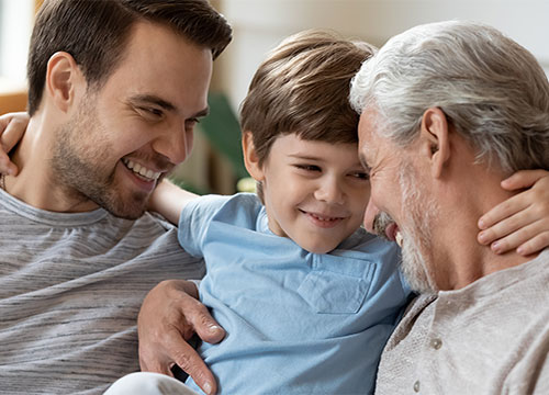 Father, son, and grandfather all embracing